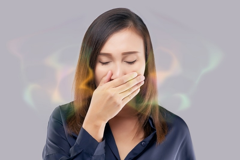 woman suffering from Halitosis