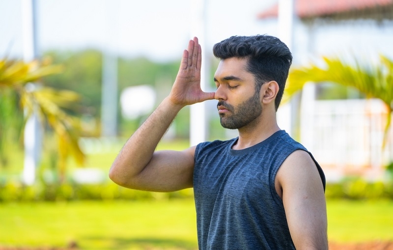 man doing yoga