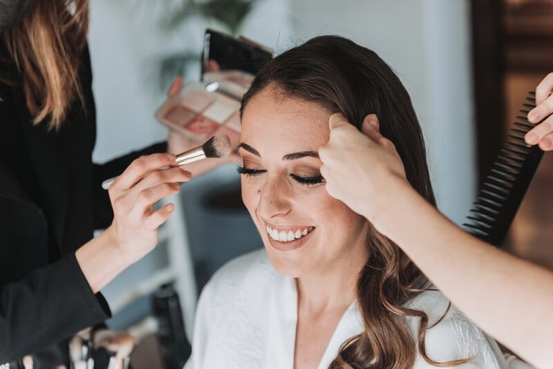 bride to be getting bridal makeup trial