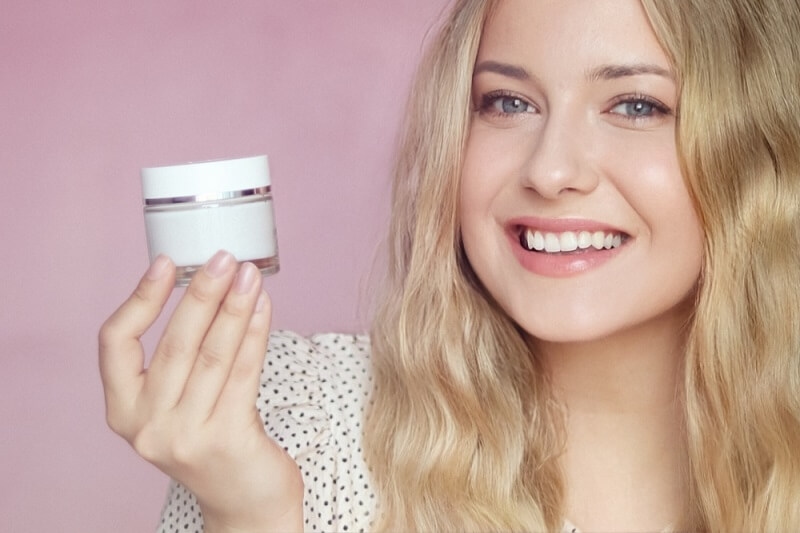 beautiful woman showing foundation 