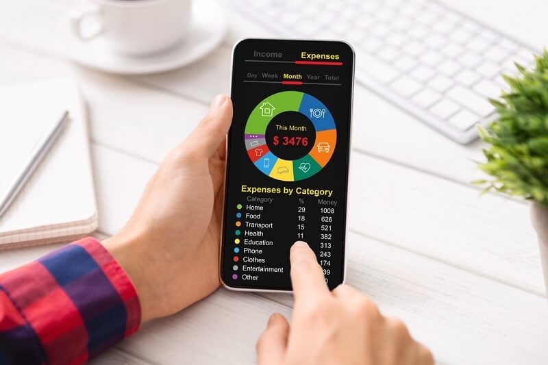man keeping track of every expense in budgeting app