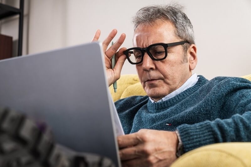 businessman reading the reviews of his business online