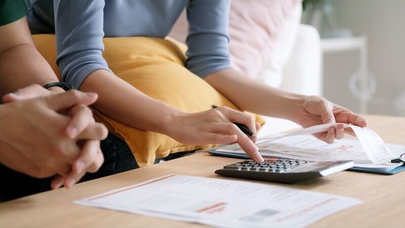 couple making financial strategies as interest rates hikes