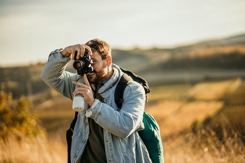 Cameraman clicking landscape pictur