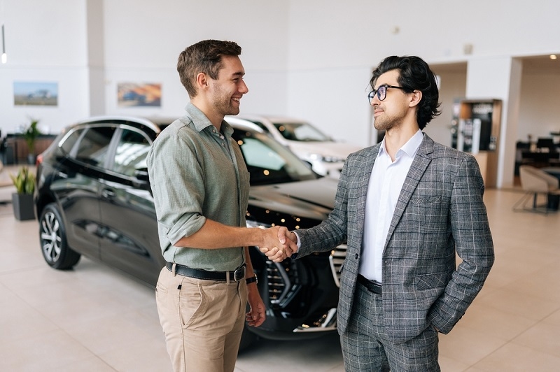 man buying car