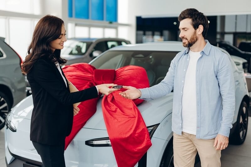 man taking delivery of car