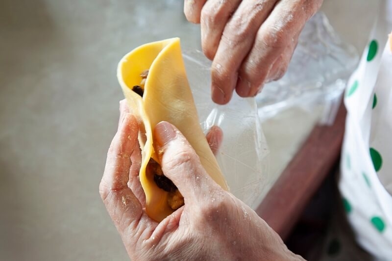 chef making Empanadas with hands