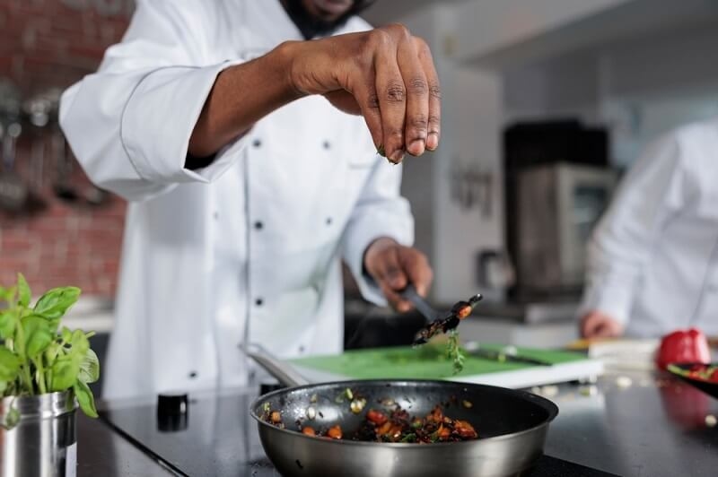 chef adding berbere spices