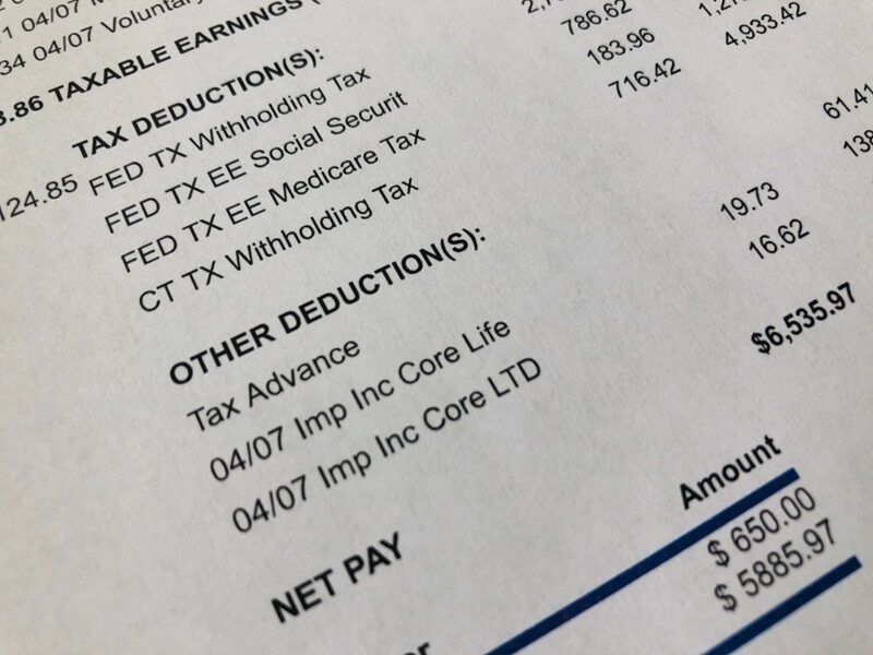close-paycheck-showing-deductions-net-pay