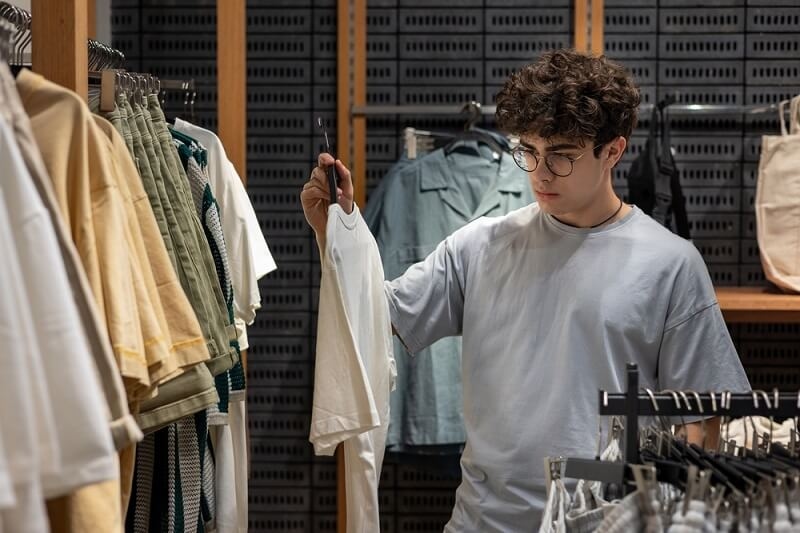 man selecting sleeve length t shirt