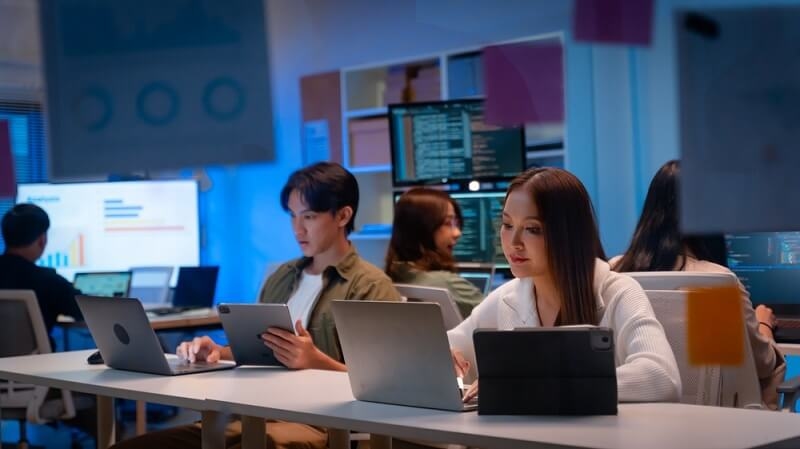 employees doing coding in office