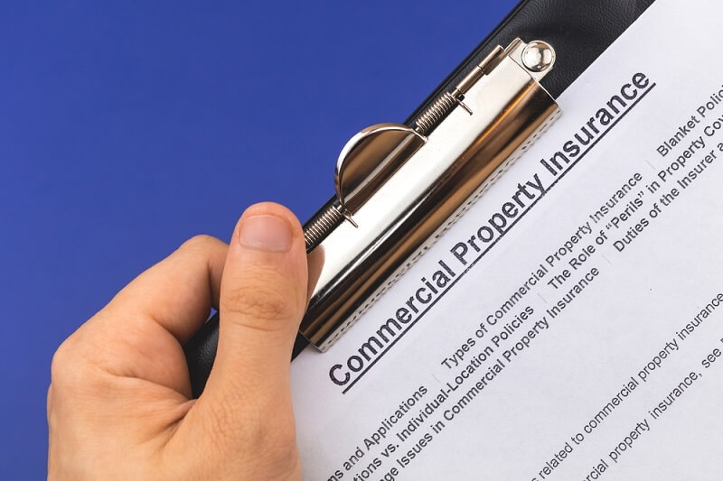 man reading commercial property insurance details
