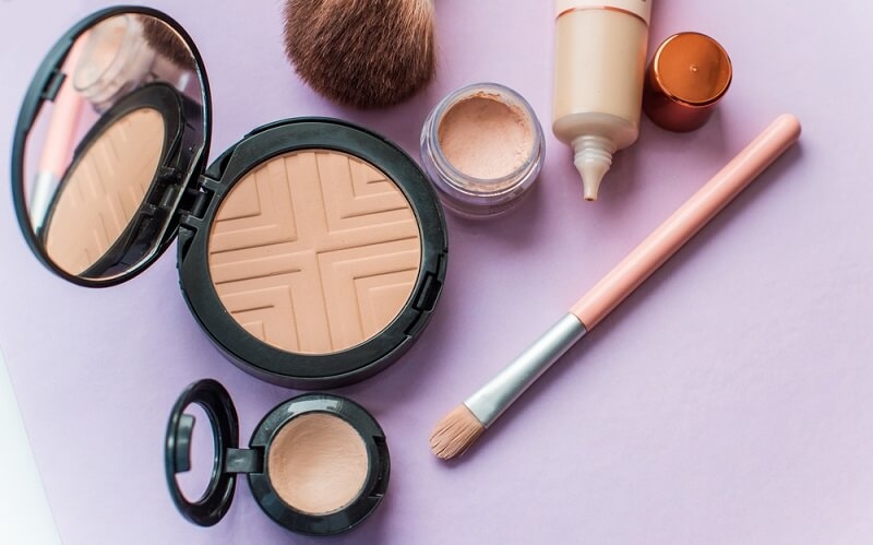 concealer with brushes and other products