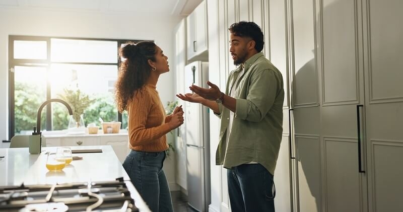 couple fighting over some argument in kitcheh
