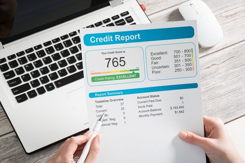 man checking his credit score from credit report