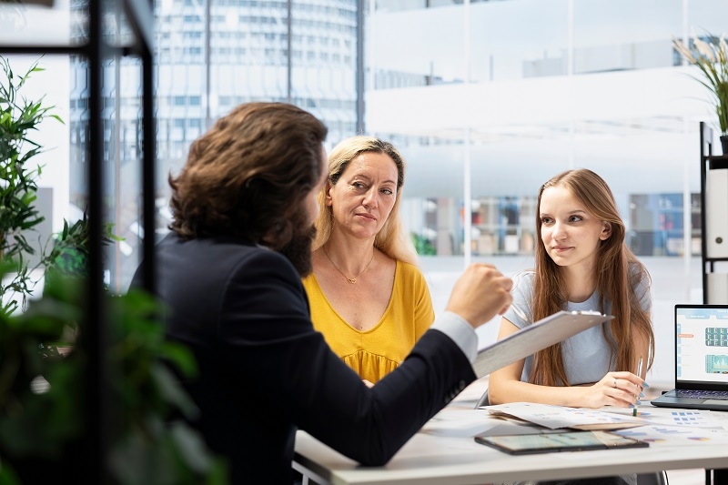 women taking advise on insurance