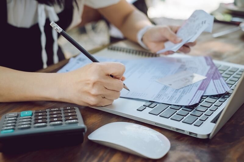 woman examining all her documents