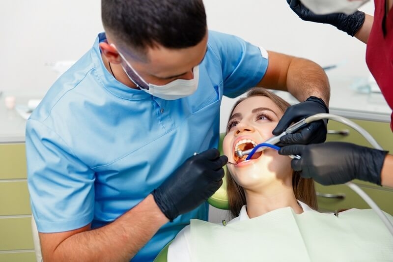 woman getting treatment under dental insurance