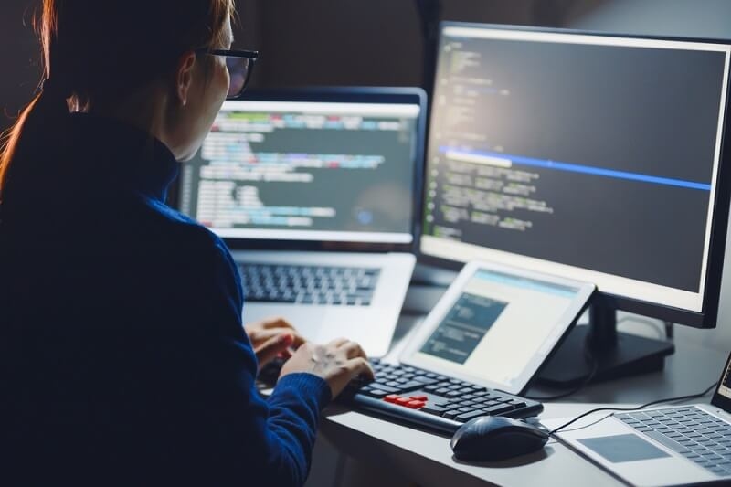 woman coder working on automation technology