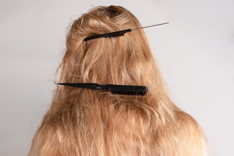 woman is trimming her hairs