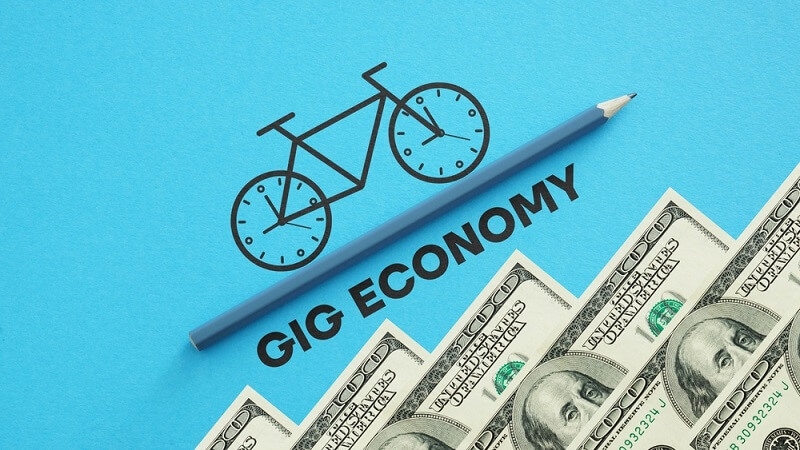 gig economy with pencil and dollars