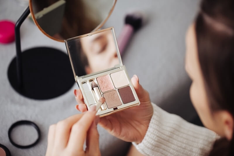 woman with makeup palette