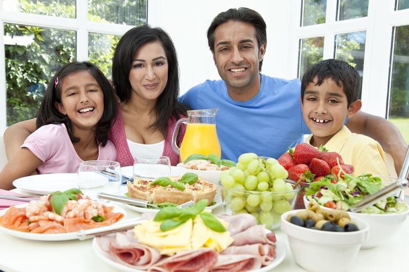 family enjoys balanced meal together