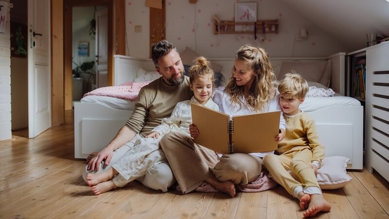 parents storytelling their kids before bed time