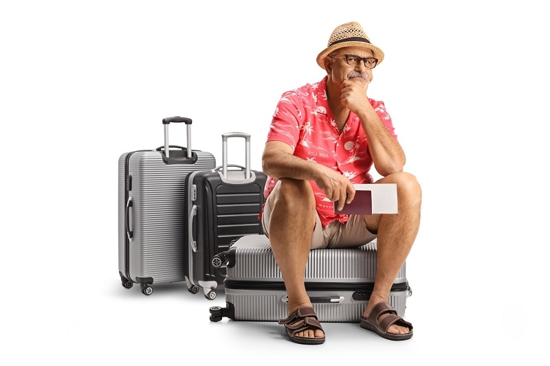 delay Flight while man Sitting on bags