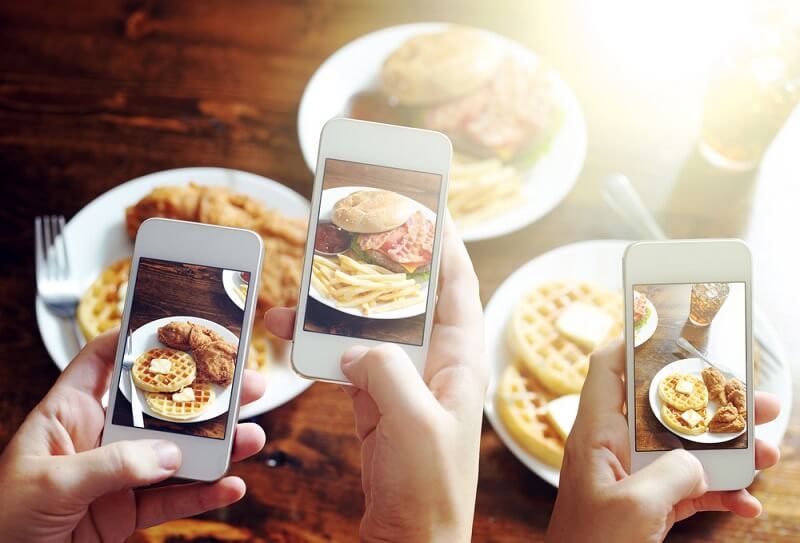 people capturing food pictures