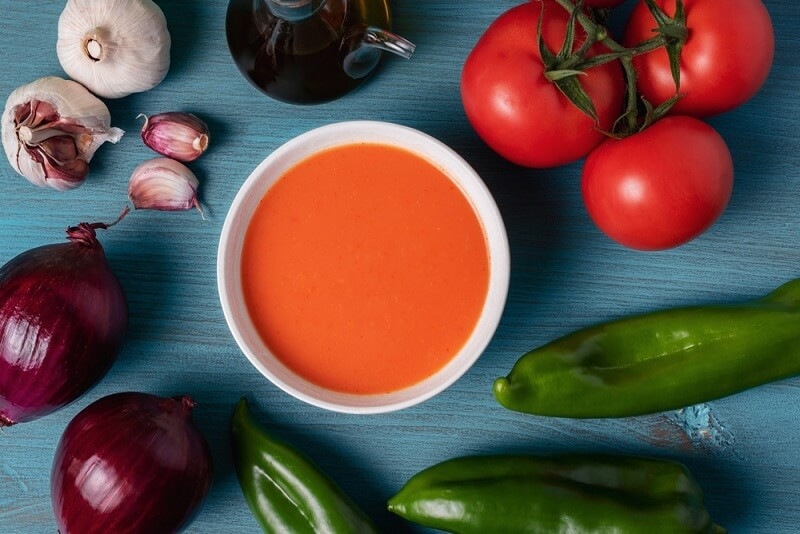 gazpacho soup preparation with vegetables