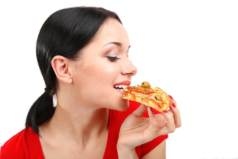 woman eating pizza