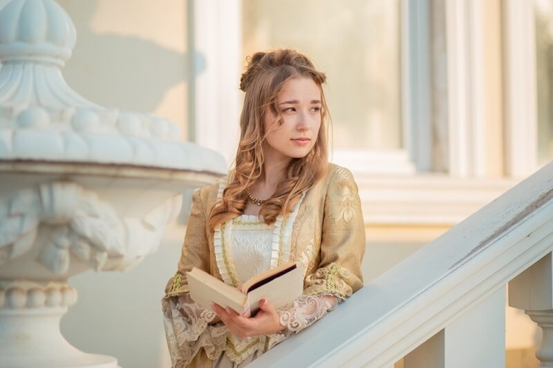young girl reading fantasy novel
