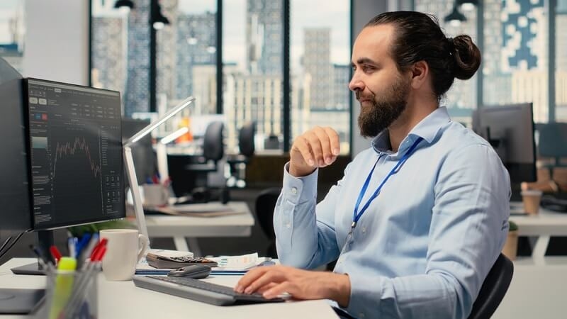 man creating a plan for investing in office