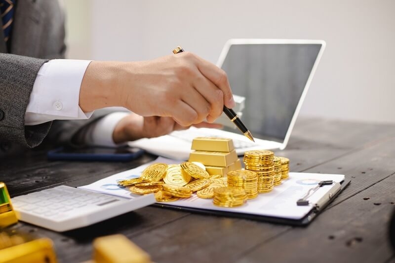 banker showing client invested gold 