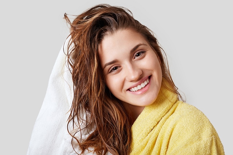 women taking  hair care