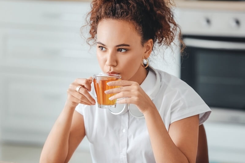 woman drinking african herbal tea