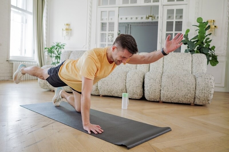 young man doing home workout