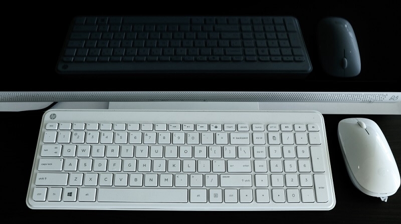 two different colors wireless keyboards and mouse