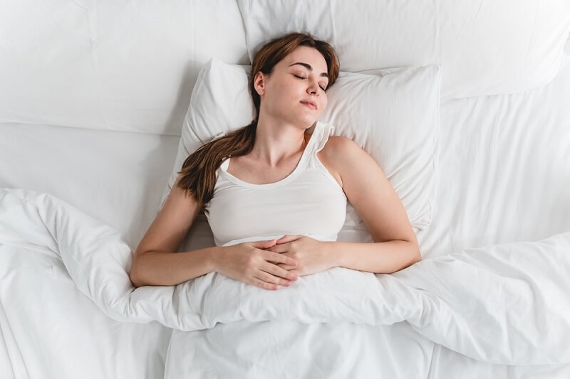 woman sleeping peacefully after breathing exercise
