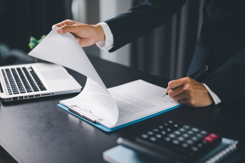 man signing annually payment option