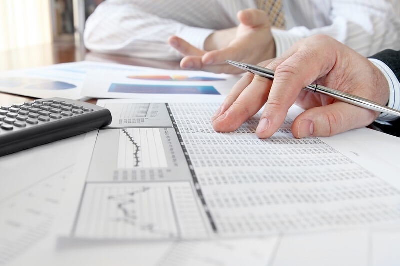 business employee checking tax deductions from list