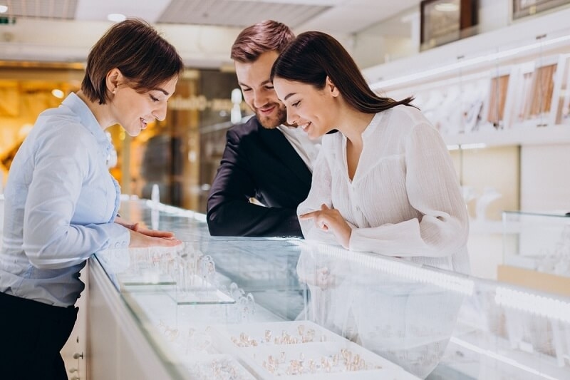 couple in diamond store selecting jewel