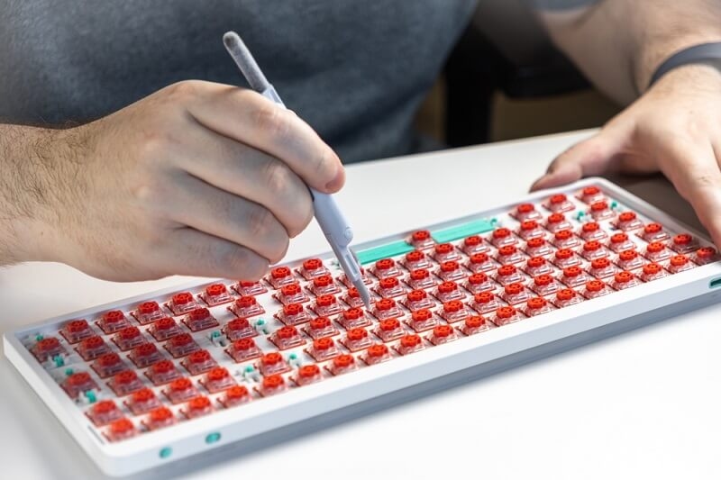 man checking keyboards buttons