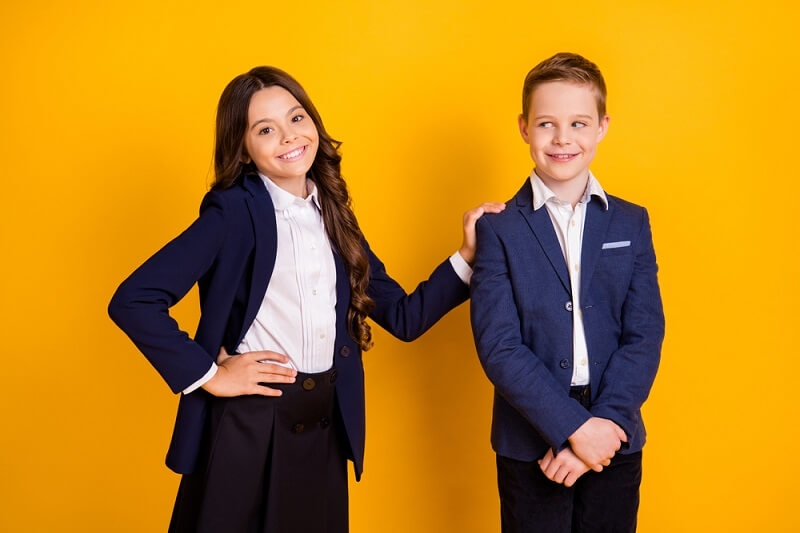 Girl and boy in blazer looking stylish