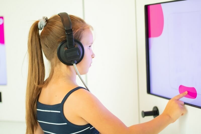 girl in school learning on new tools