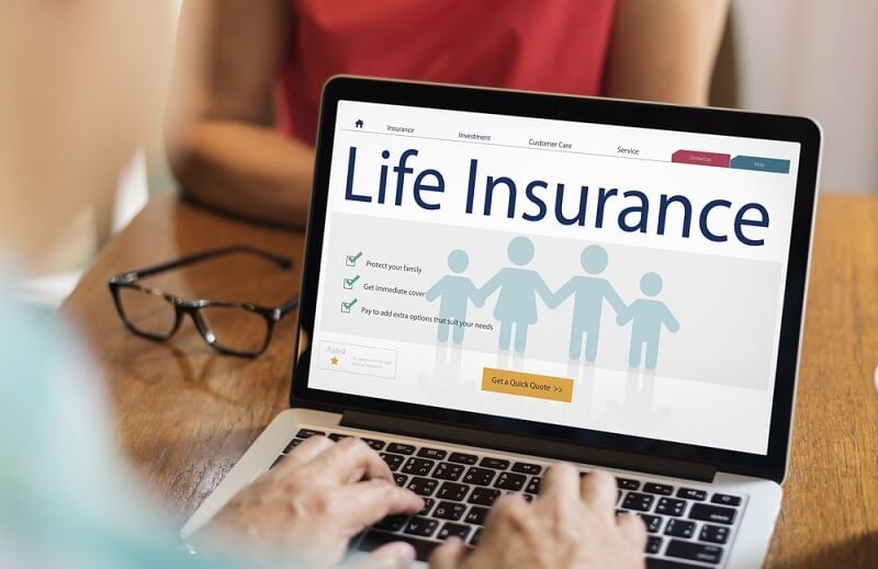 man checking status of life insurance claim online