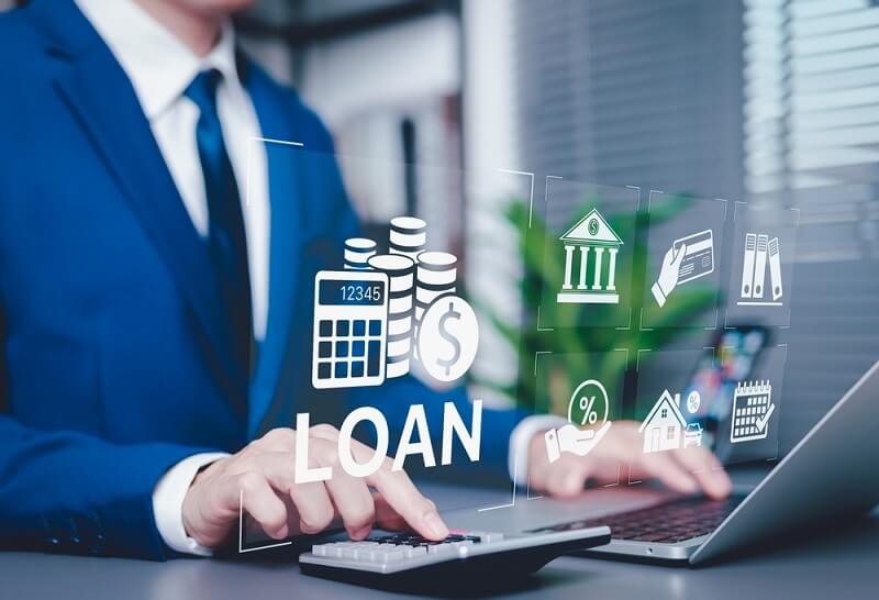 businessman calculating changes in loan rates