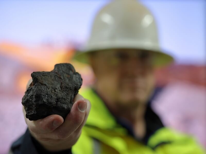 man showing magnesium ore