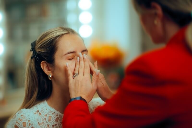 woman preparing makeup base
